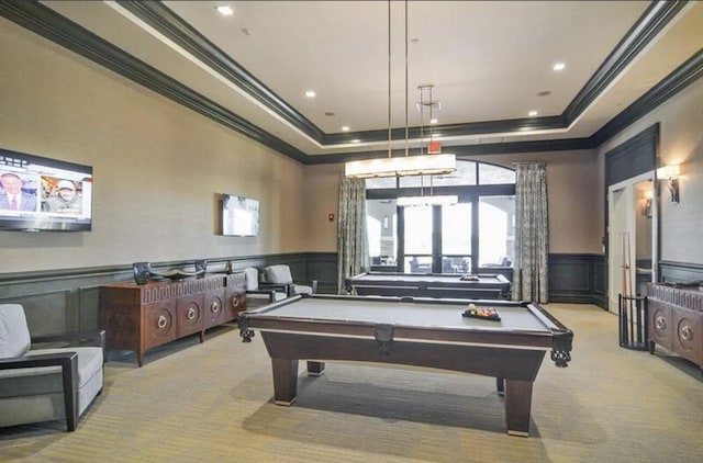 recreation room with billiards, a tray ceiling, and light carpet