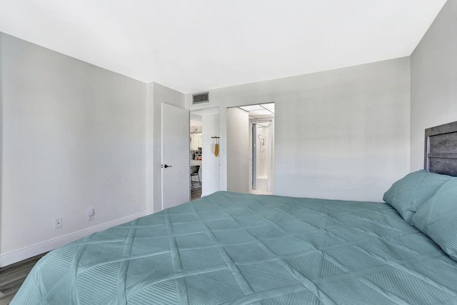 bedroom featuring hardwood / wood-style flooring