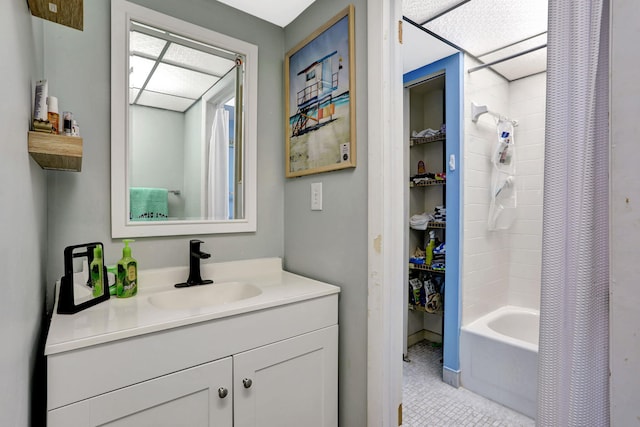 bathroom with tile patterned floors, vanity, and shower / bathtub combination with curtain