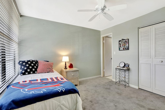 carpeted bedroom featuring a closet and ceiling fan