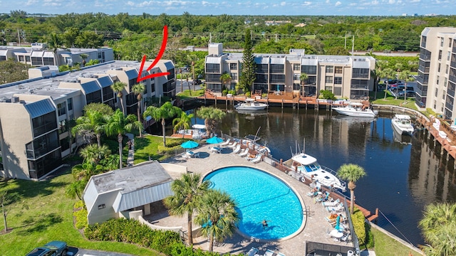 birds eye view of property featuring a water view