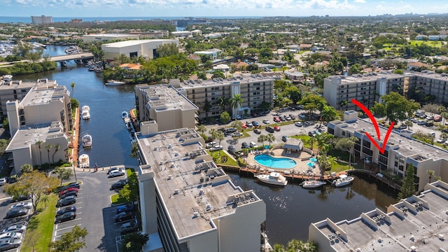 birds eye view of property with a water view