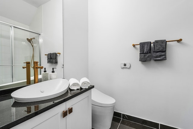 bathroom with vanity, an enclosed shower, tile patterned floors, and toilet