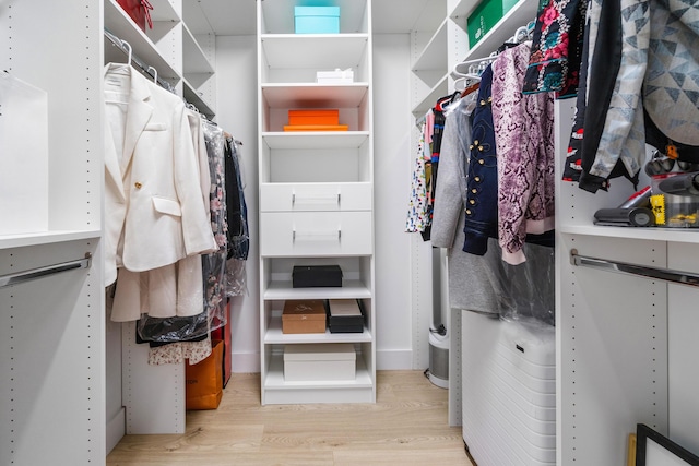 spacious closet featuring light wood-type flooring