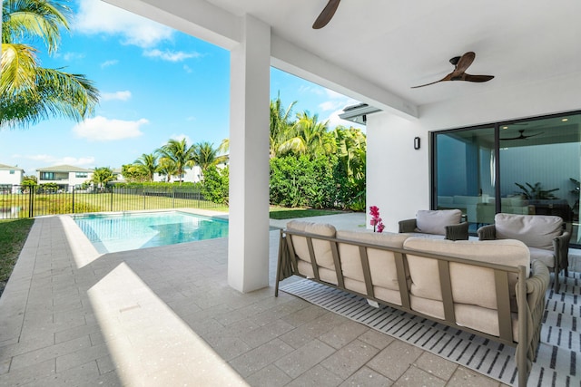 view of swimming pool featuring an outdoor living space, a patio, and ceiling fan