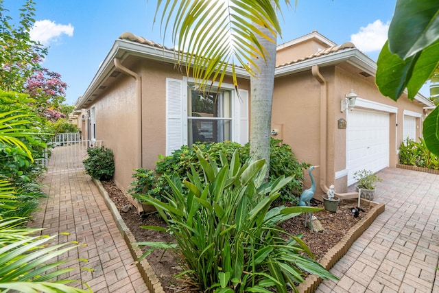 view of property exterior featuring a garage