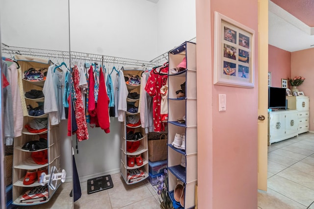 spacious closet featuring tile patterned floors