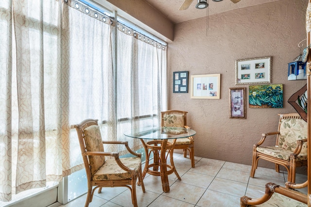 tiled dining room with ceiling fan