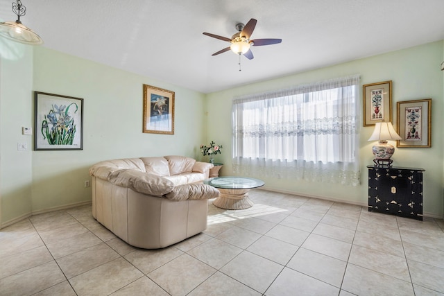 living room featuring light tile patterned floors and ceiling fan