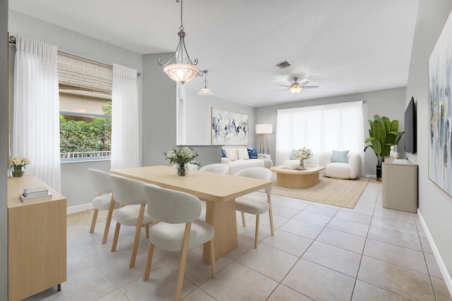 dining room featuring light tile patterned floors and ceiling fan