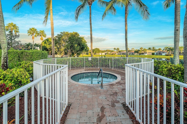 view of pool with an in ground hot tub