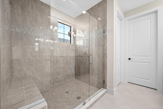 bathroom with a notable chandelier and a shower with door