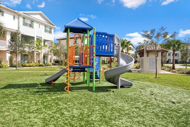 view of playground with a lawn