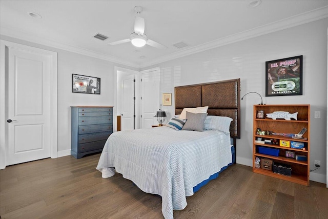 bedroom with crown molding, dark wood-type flooring, and ceiling fan