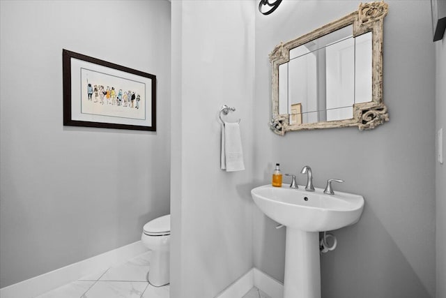 bathroom with sink and toilet