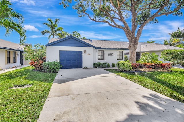 ranch-style house with a garage and a front lawn