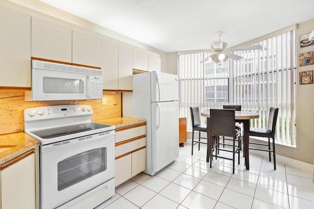 kitchen with white cabinetry, a textured ceiling, white appliances, and decorative backsplash