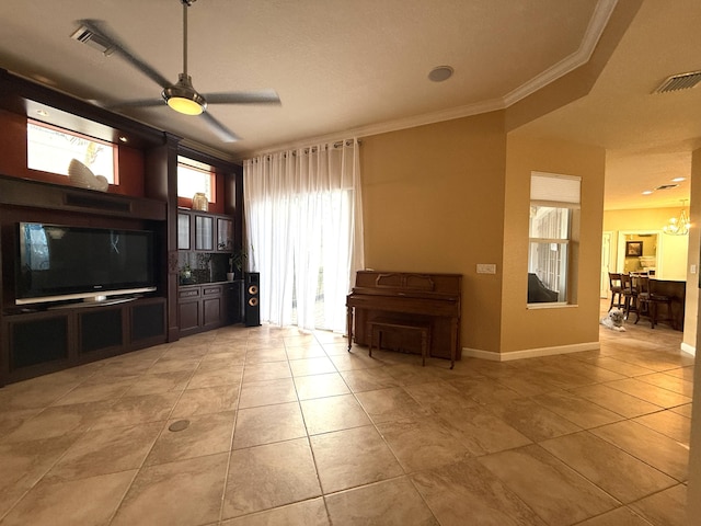 unfurnished living room featuring visible vents, crown molding, baseboards, light tile patterned floors, and ceiling fan with notable chandelier