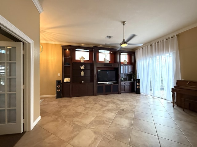 unfurnished living room with light tile patterned floors, a ceiling fan, visible vents, and ornamental molding