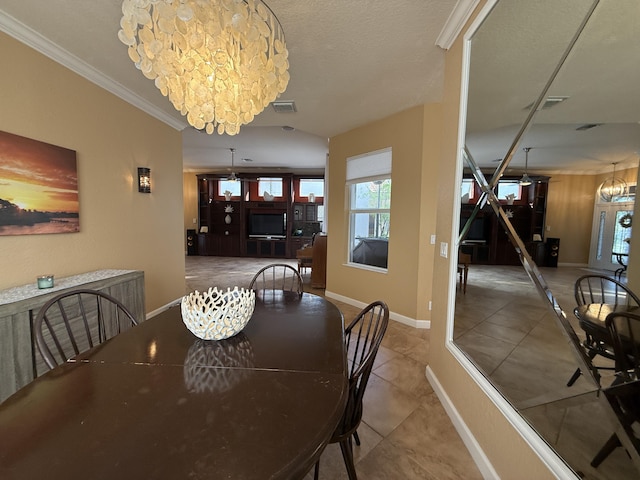 tiled dining area featuring an inviting chandelier, baseboards, visible vents, and ornamental molding