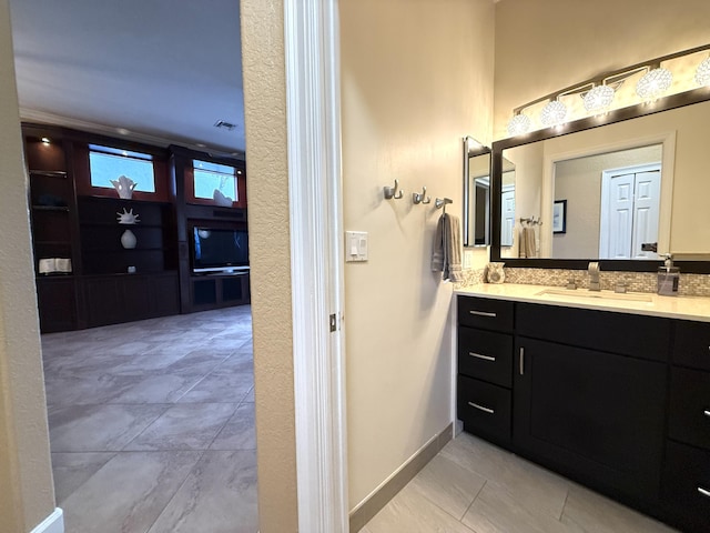 bathroom featuring vanity and baseboards