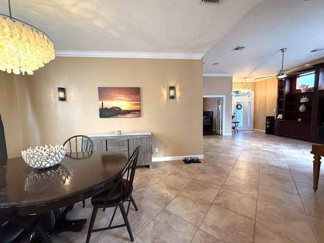 dining room featuring visible vents, baseboards, a notable chandelier, and ornamental molding