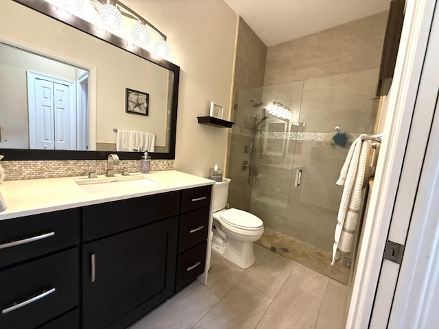 full bath with vanity, toilet, a stall shower, and backsplash