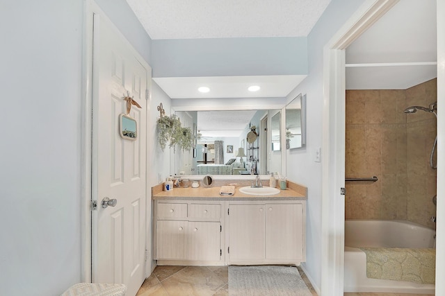 ensuite bathroom featuring ensuite bath, tub / shower combination, and vanity