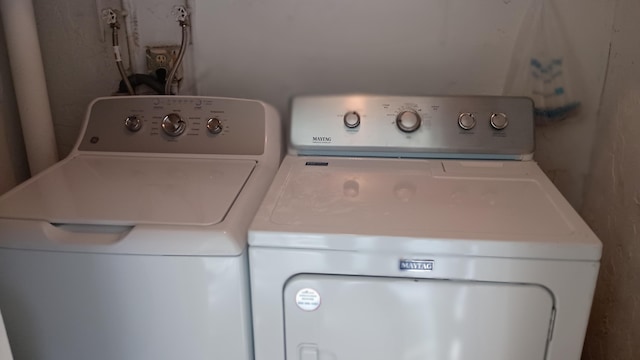 laundry room featuring washer and clothes dryer