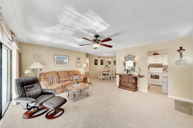 living room with baseboards, light carpet, a textured ceiling, and ceiling fan