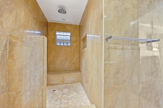 bathroom featuring tiled shower