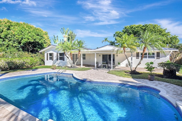 pool with a patio area