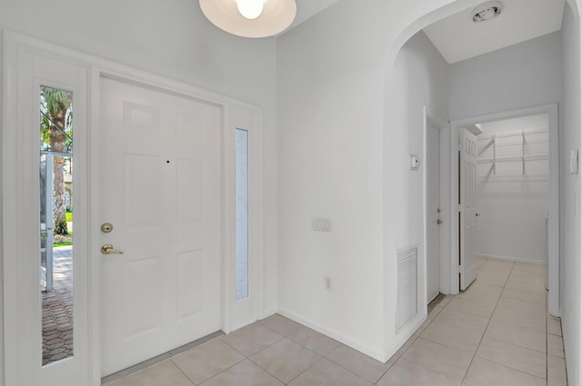 foyer entrance with light tile patterned flooring