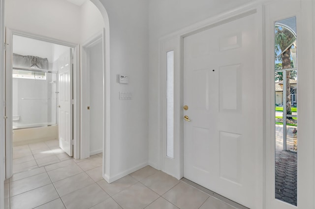 entryway with light tile patterned flooring