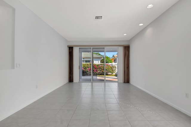 empty room featuring light tile patterned floors