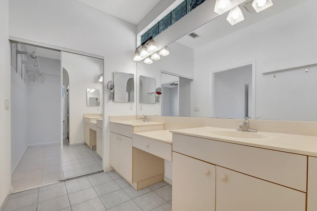 bathroom with tile patterned flooring and vanity