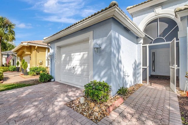 view of side of property with a garage