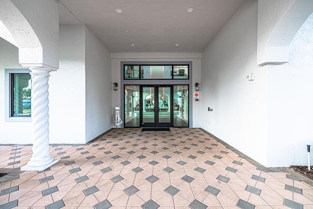 property entrance featuring french doors