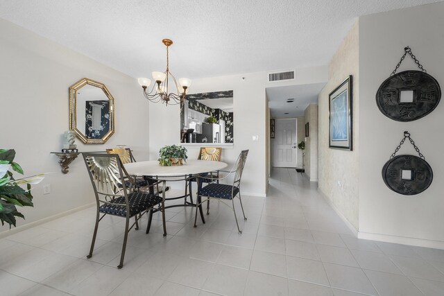 living room featuring light tile patterned flooring and a textured ceiling