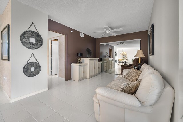 sunroom featuring a water view and ceiling fan