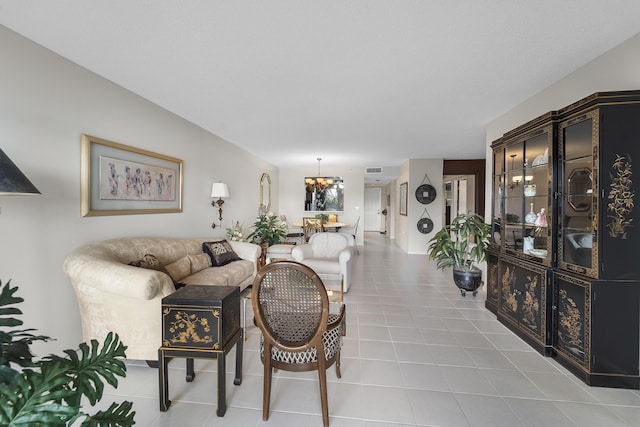 tiled living room with an inviting chandelier