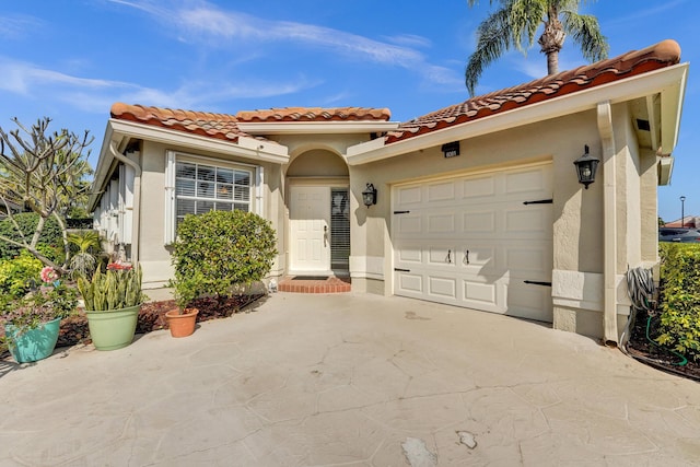 mediterranean / spanish-style home featuring a garage