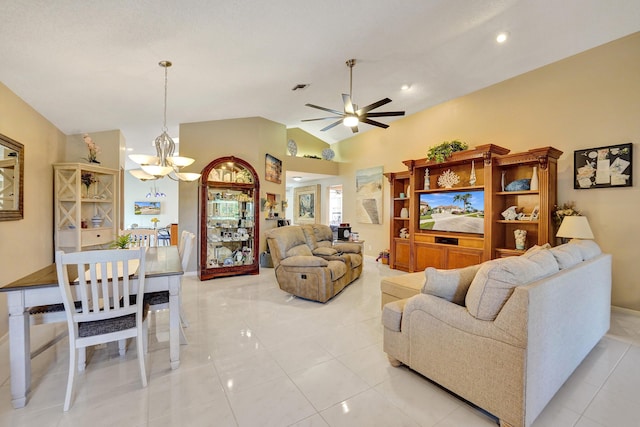 tiled living room featuring lofted ceiling and ceiling fan with notable chandelier