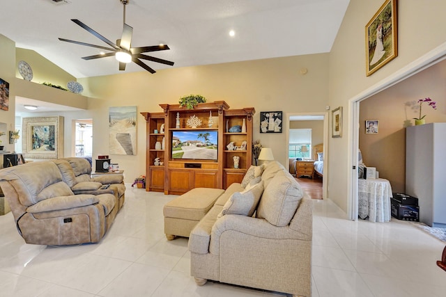 tiled living room with lofted ceiling and ceiling fan