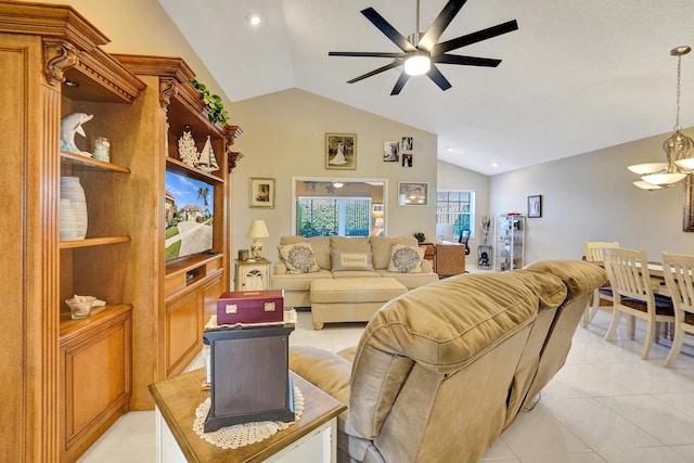 tiled living room with ceiling fan with notable chandelier and vaulted ceiling