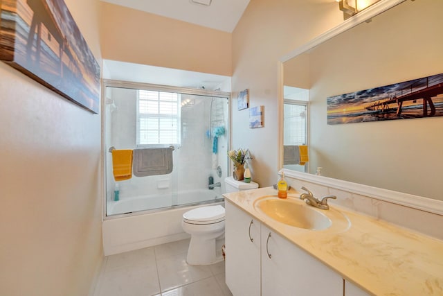 full bathroom featuring toilet, tile patterned floors, bath / shower combo with glass door, and vanity