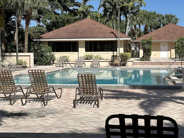 view of swimming pool featuring a patio area