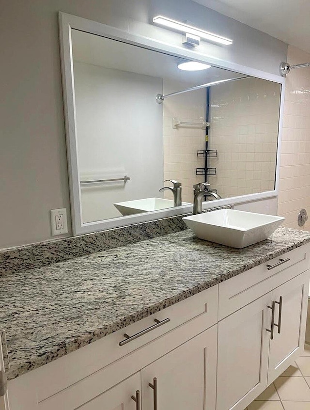 bathroom featuring tile patterned floors and vanity