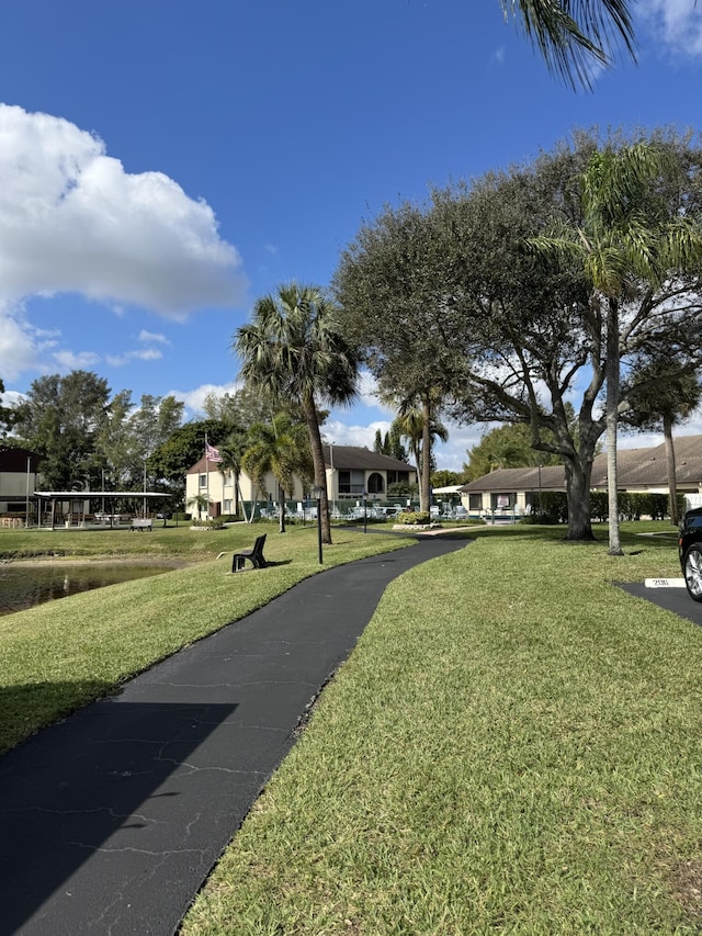 view of home's community with a yard