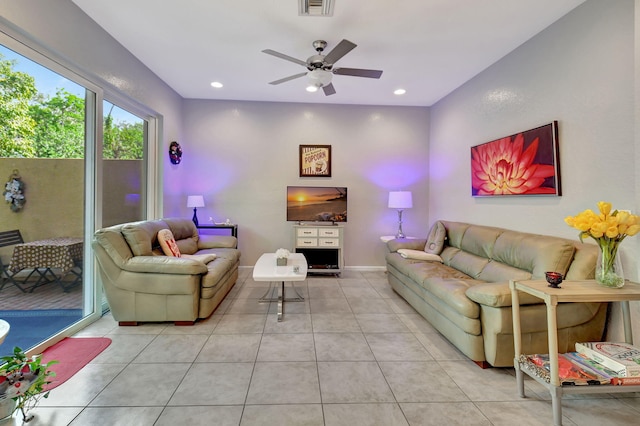 living room with light tile patterned floors and ceiling fan